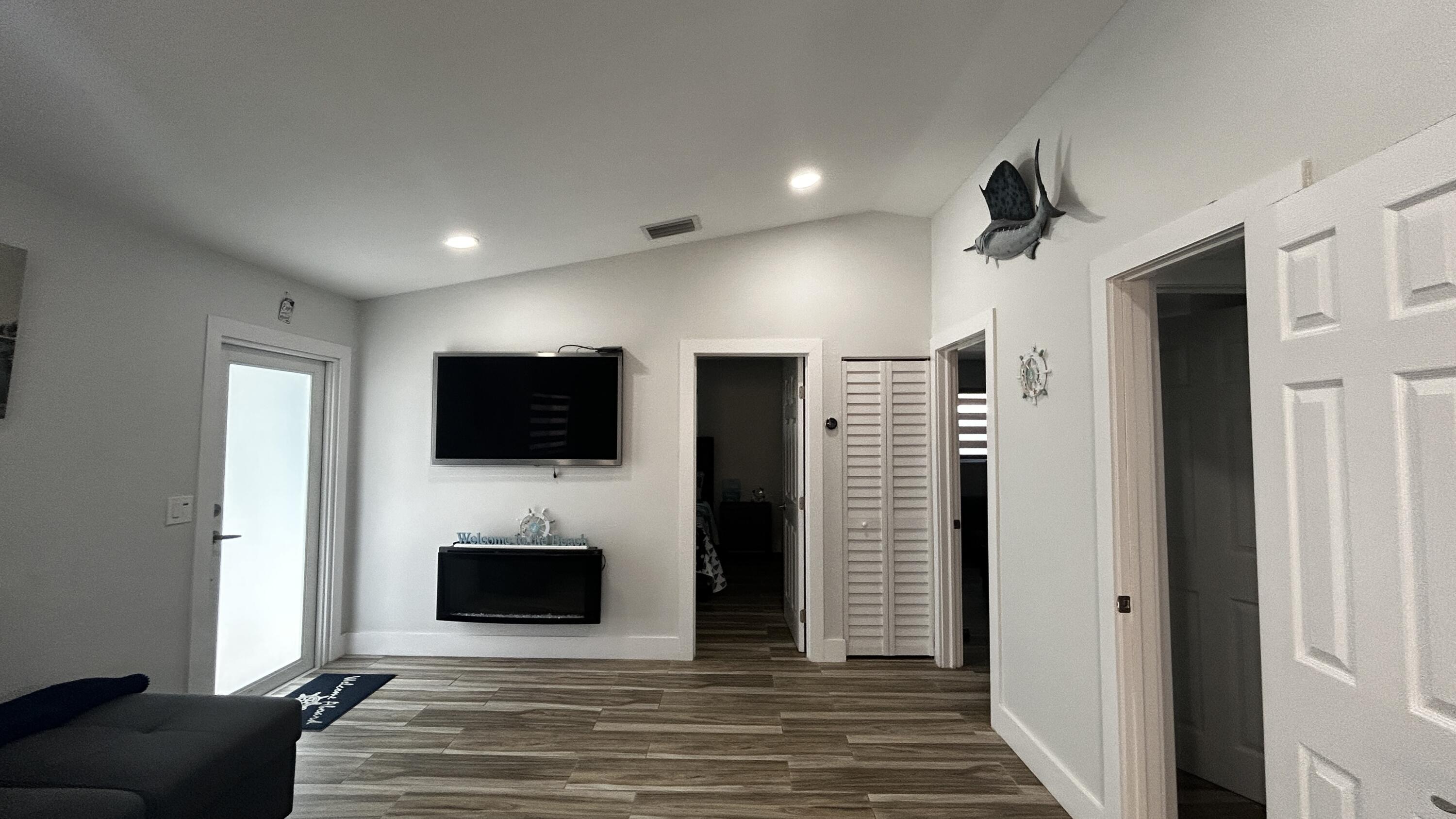 423 Mahogany Avenue Key Largo, FL 33037 - Photo 21 of 37 a living room with furniture and a flat screen tv