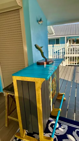 a kitchen with stainless steel appliances kitchen island granite countertop a table chairs sink and cabinets