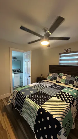 a bedroom with a bed and window