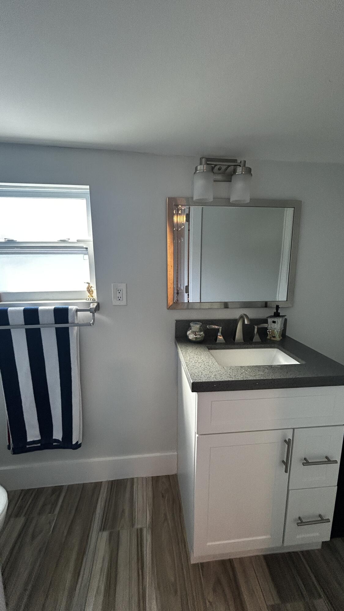 423 Mahogany Avenue Key Largo, FL 33037 - Photo 26 of 37 a bathroom with a sink and mirror