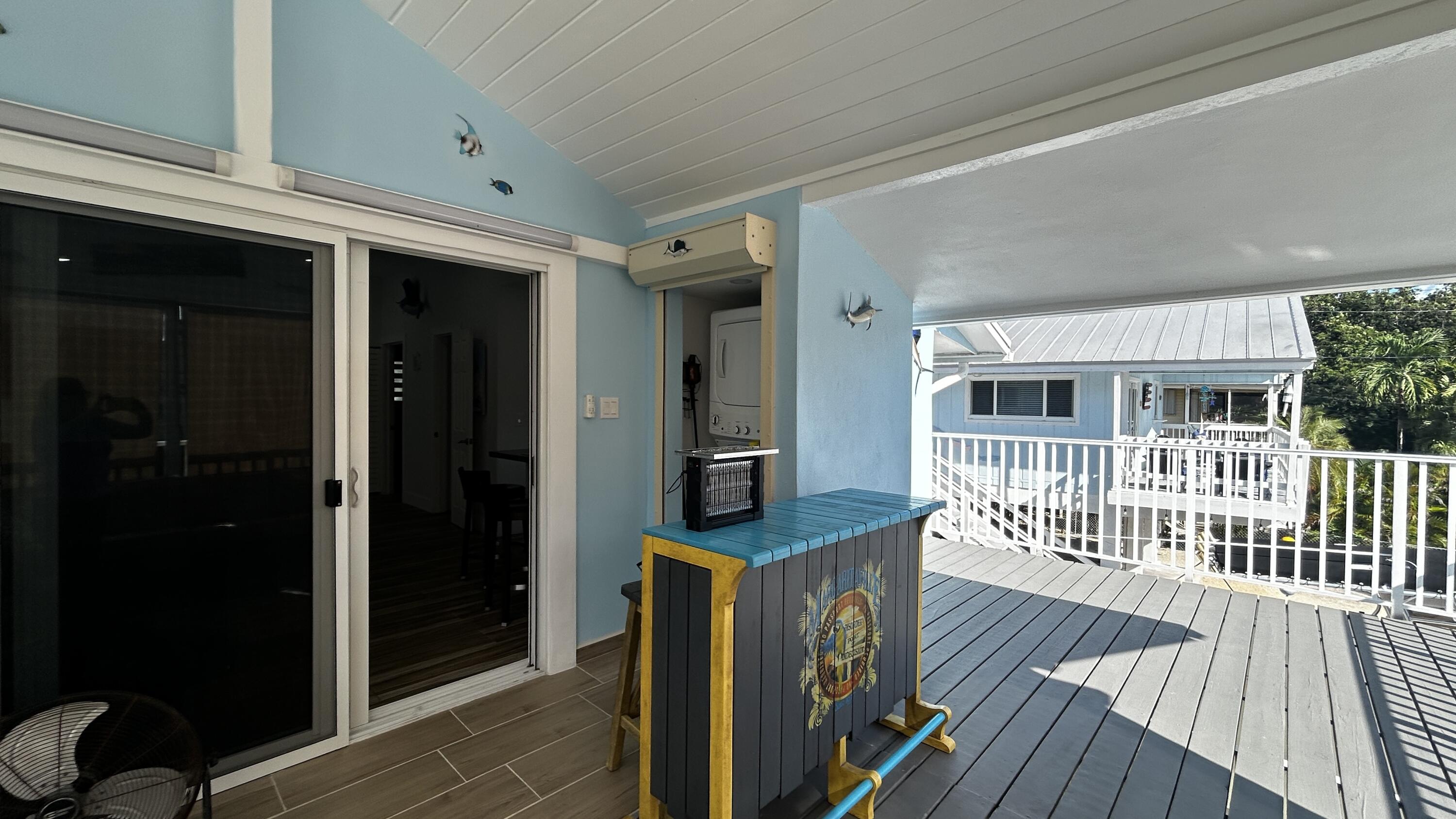 423 Mahogany Avenue Key Largo, FL 33037 - Photo 3 of 37 a view of a house with wooden floor