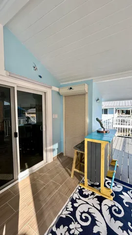 a view of a balcony with wooden floor