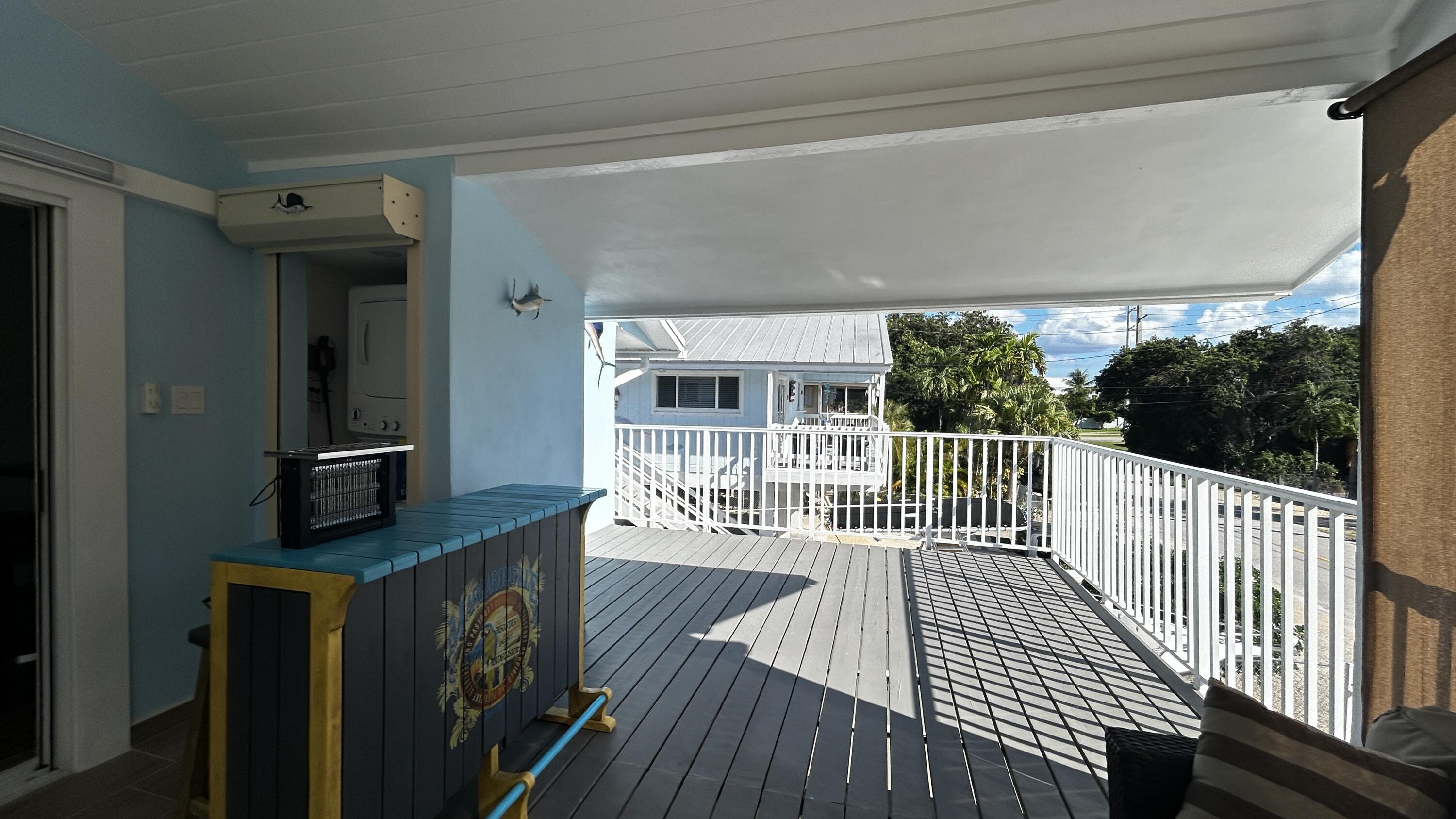 423 Mahogany Avenue Key Largo, FL 33037 - Photo 34 of 37 a view of a balcony with wooden floor