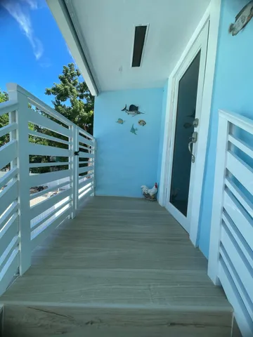 a view of wooden floor and windows in a room