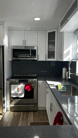 a kitchen with appliances and cabinets