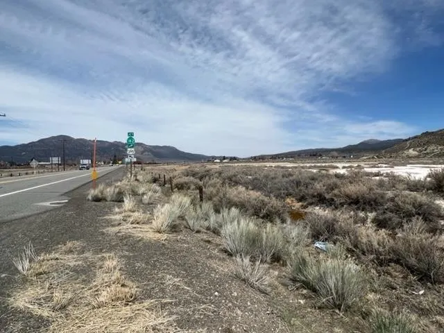 a view of a road with mountains in the background