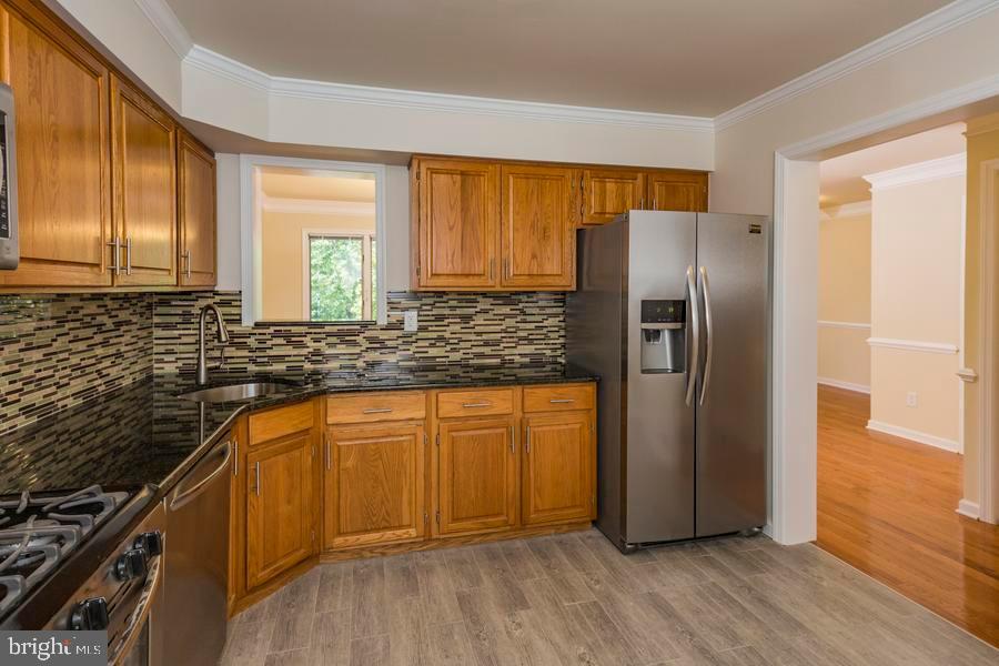 20 Exeter Court Princeton, NJ 08540 - Photo 11 of 25 a kitchen with stainless steel appliances granite countertop a refrigerator and a sink