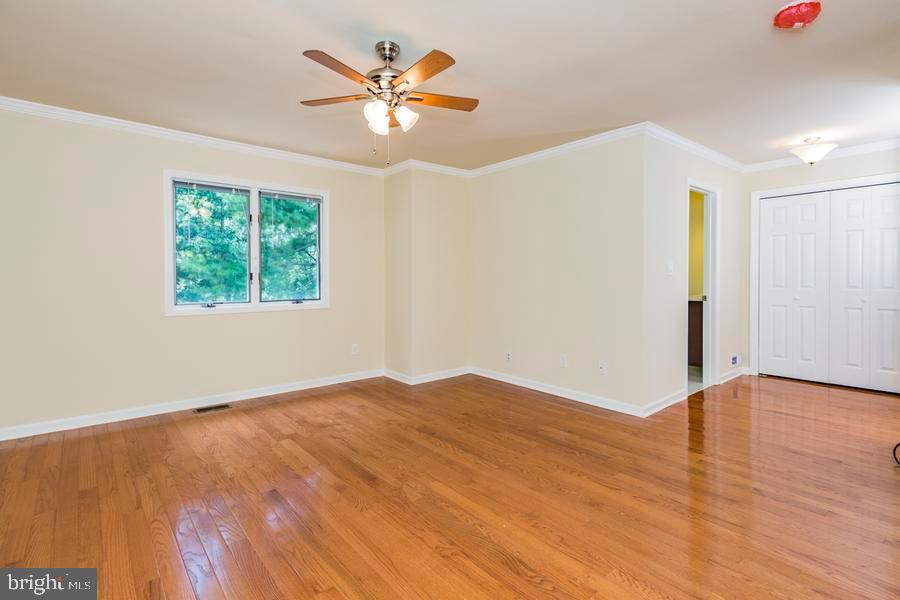 20 Exeter Court Princeton, NJ 08540 - Photo 14 of 25 wooden floor in an empty room with a window