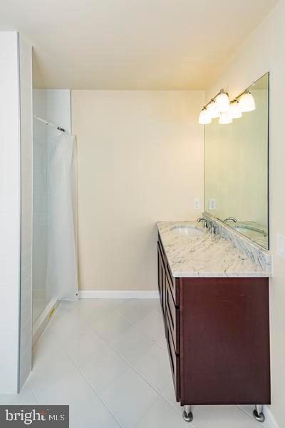 20 Exeter Court Princeton, NJ 08540 - Photo 16 of 25 a bathroom with a granite countertop sink and mirror