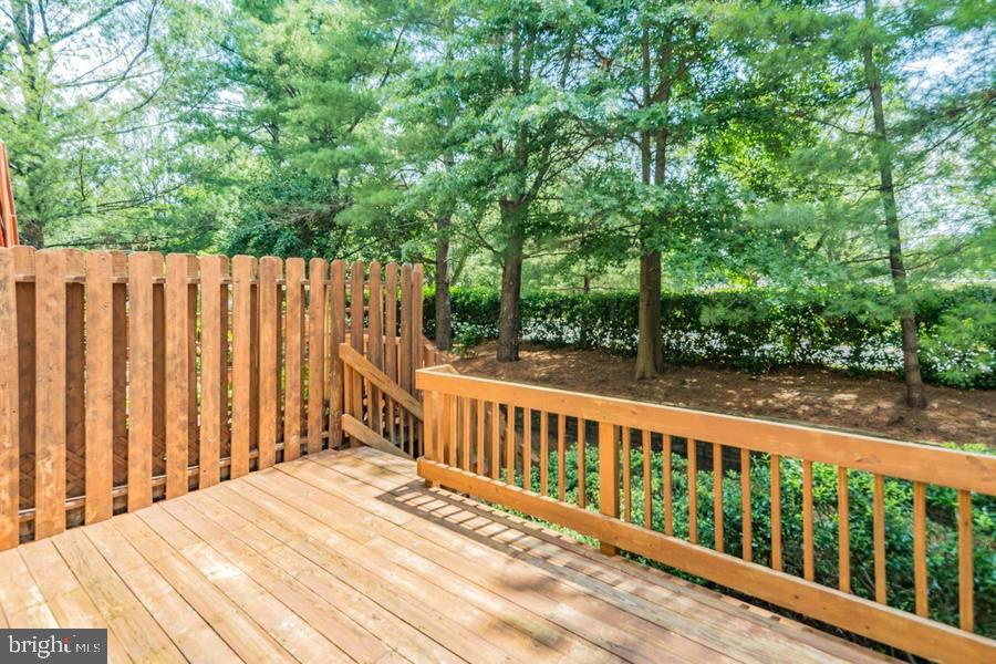 20 Exeter Court Princeton, NJ 08540 - Photo 24 of 25 a balcony with wooden floor and yard in the back