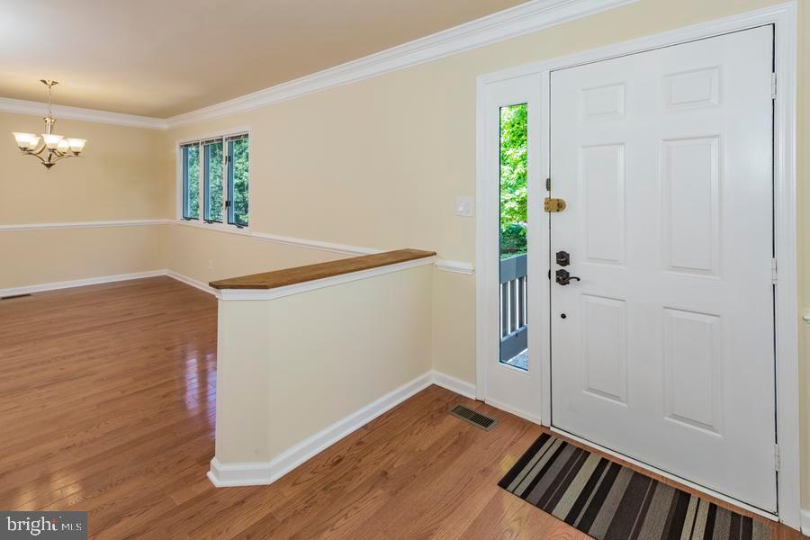 20 Exeter Court Princeton, NJ 08540 - Photo 3 of 25 a view of an empty room with wooden floor