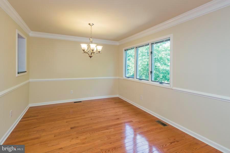 20 Exeter Court Princeton, NJ 08540 - Photo 4 of 25 wooden floor in an empty room with a window