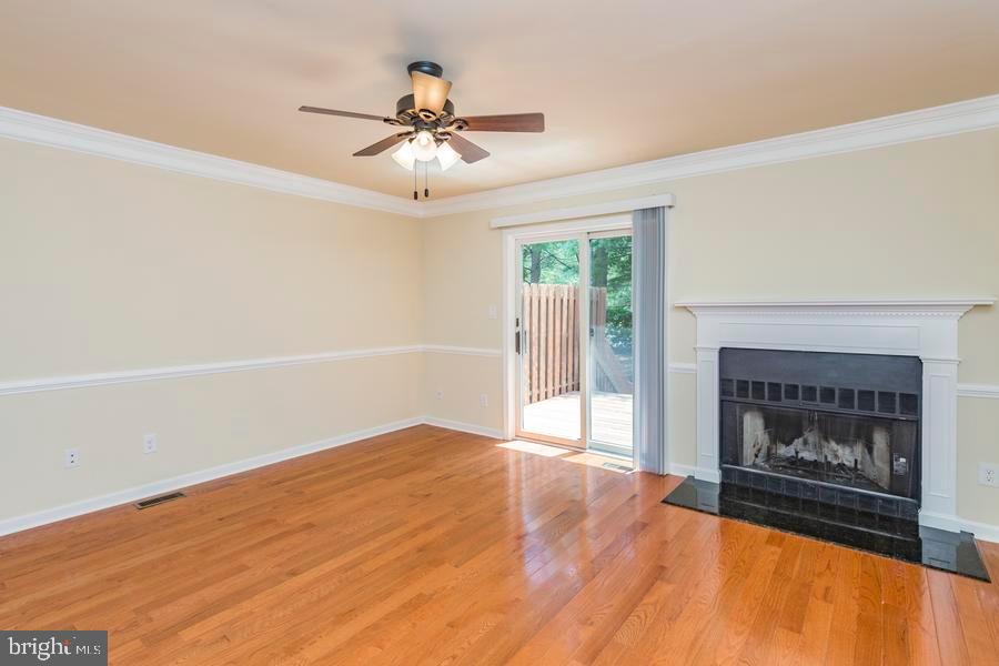 20 Exeter Court Princeton, NJ 08540 - Photo 7 of 25 a view of an empty room with wooden floor fireplace and a window