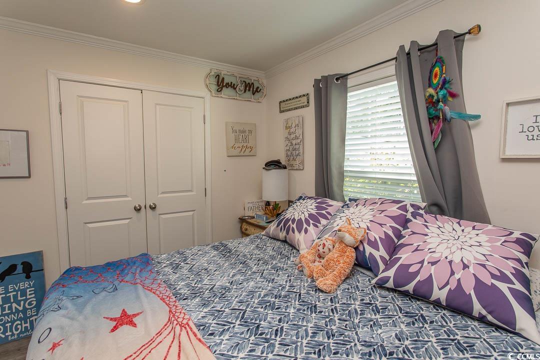 2737 Capricorn Drive Myrtle Beach, SC 29575 - Photo 24 of 27 Bedroom featuring ornamental molding and a closet