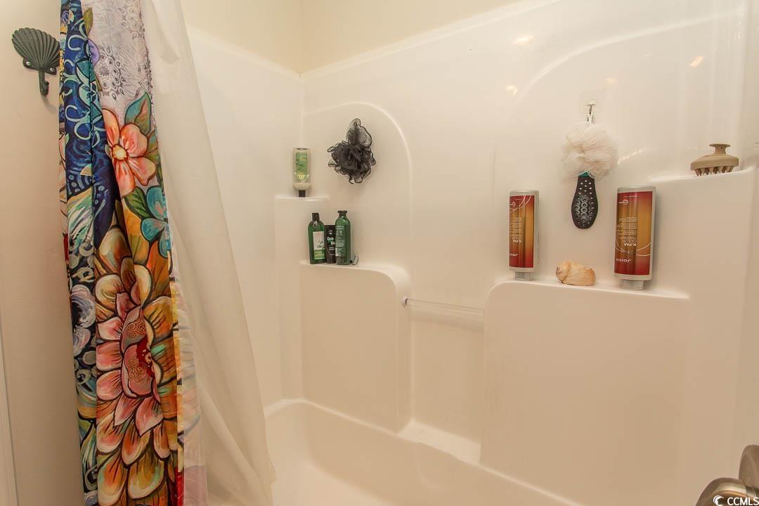 2737 Capricorn Drive Myrtle Beach, SC 29575 - Photo 25 of 27 Full bathroom featuring shower / bath combo with shower curtain