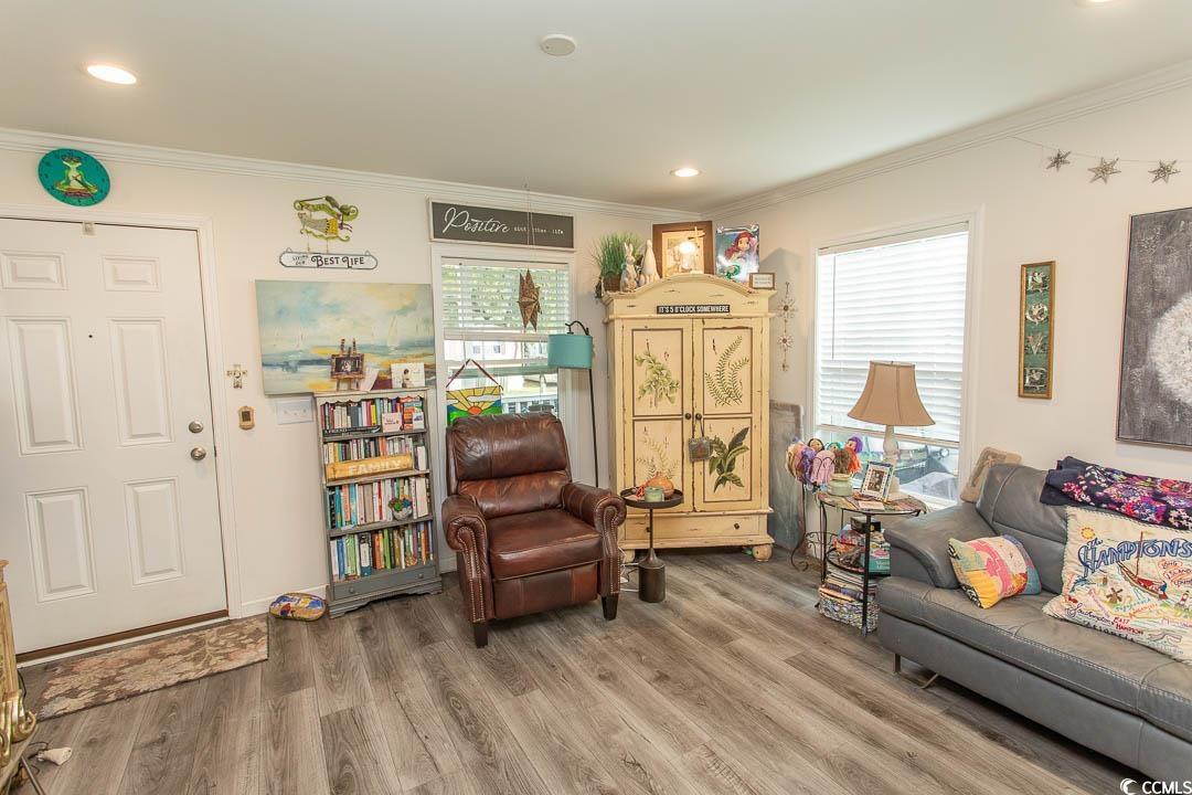 2737 Capricorn Drive Myrtle Beach, SC 29575 - Photo 8 of 27 Sitting room with crown molding, wood finished floors, and recessed lighting