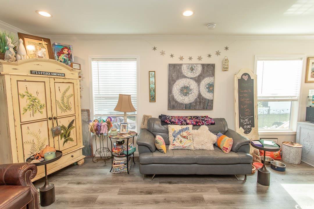2737 Capricorn Drive Myrtle Beach, SC 29575 - Photo 10 of 27 Living area with wood finished floors, ornamental molding, and recessed lighting