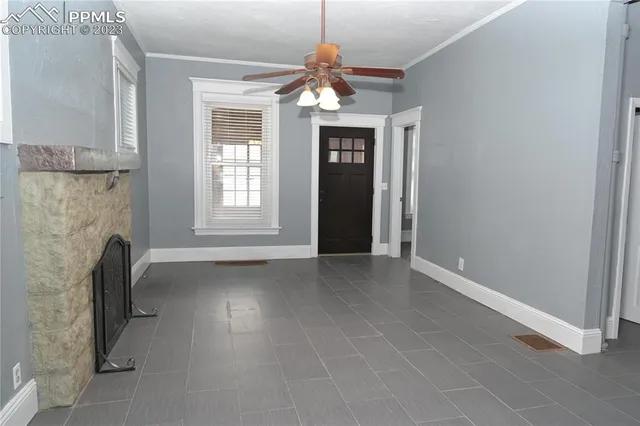 wooden floor in an empty room with a fireplace