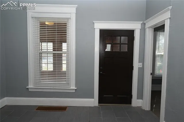 a view of wooden door of a house
