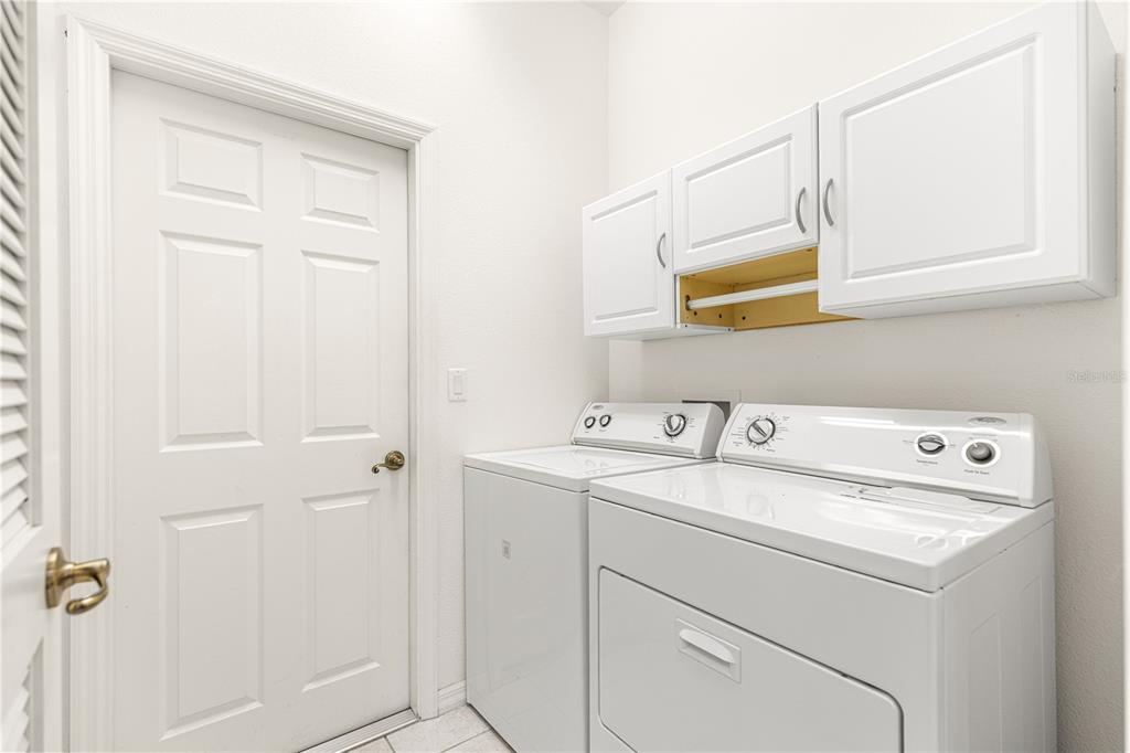 9317 Southwest 94th Loop Ocala, FL 34481 - Photo 29 of 40 a utility room with dryer and washer