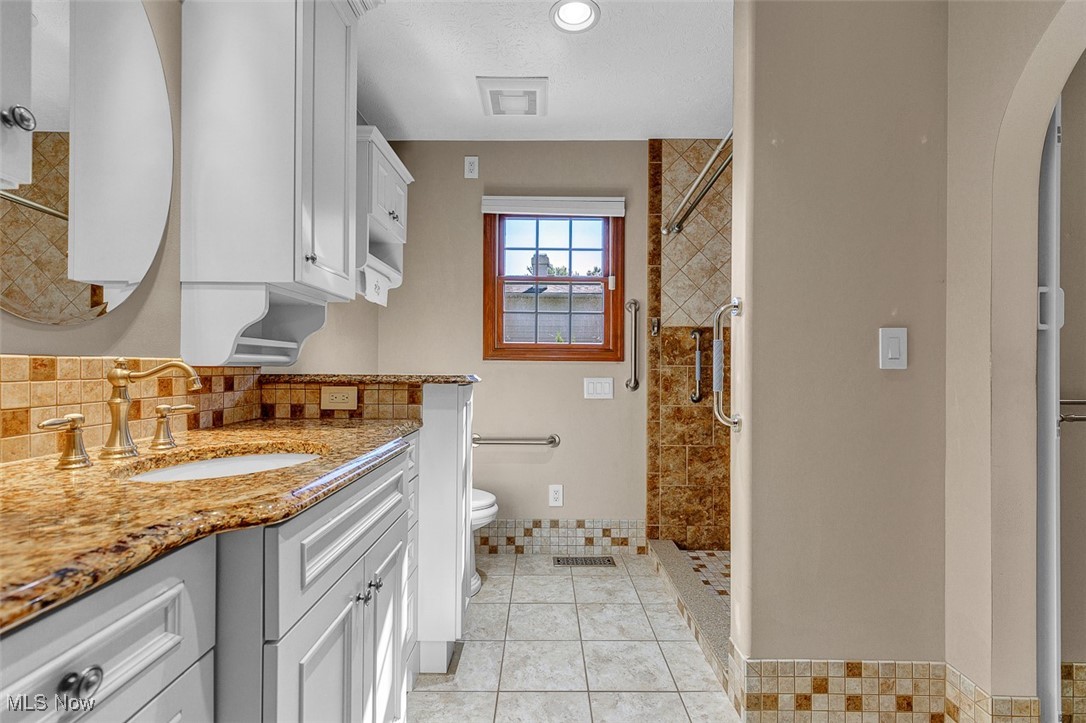 41575 Russia Road Elyria, OH 44035 - Photo 16 of 37 2nd Master Suite Bathroom with a stall shower, vanity, light tile patterned floors, recessed lighting, and a textured ceiling