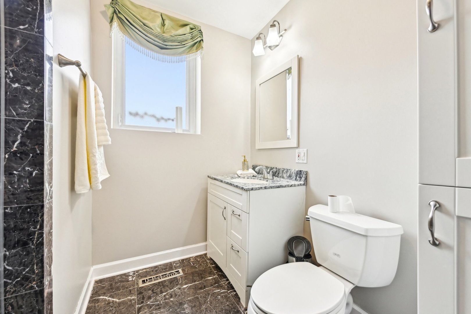 1420 Oakton Street Park Ridge, IL 60068 - Photo 20 of 62 a white toilet sitting next to a bathroom sink