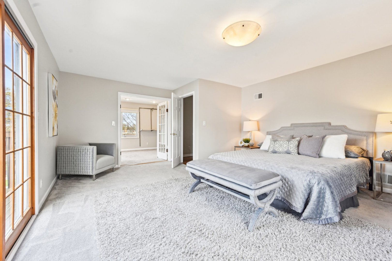 1420 Oakton Street Park Ridge, IL 60068 - Photo 24 of 62 a spacious bedroom with a bed and a window