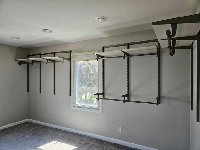 a bedroom with a bed and a table