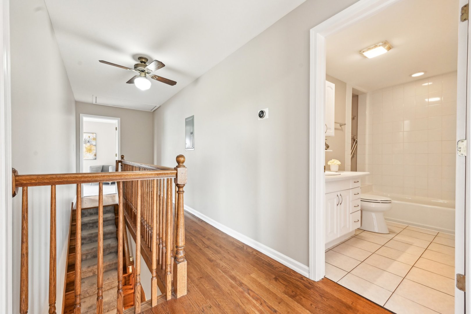 1420 Oakton Street Park Ridge, IL 60068 - Photo 33 of 62 a view of a hallway with a dining room and chandelier fan
