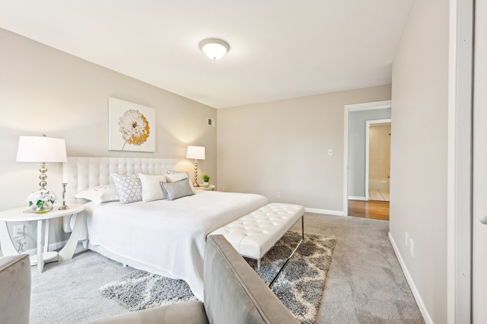 1420 Oakton Street Park Ridge, IL 60068 - Photo 38 of 62 a bedroom with a large bed and a lamp