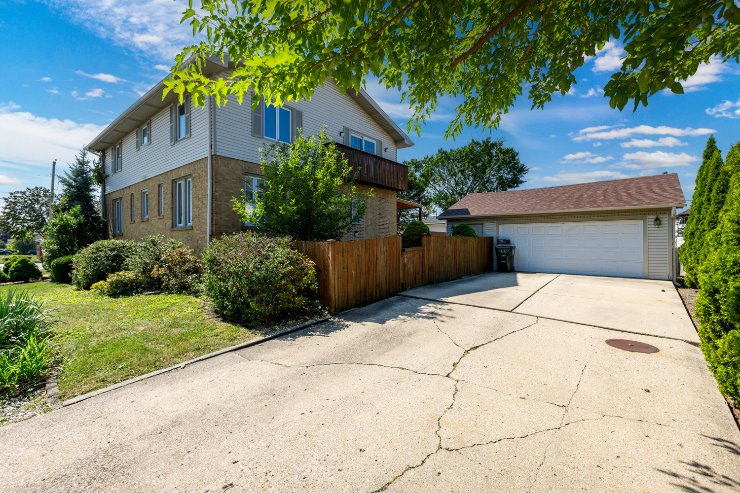 1420 Oakton Street Park Ridge, IL 60068 - Photo 56 of 62 a front view of a house with a yard and potted plants