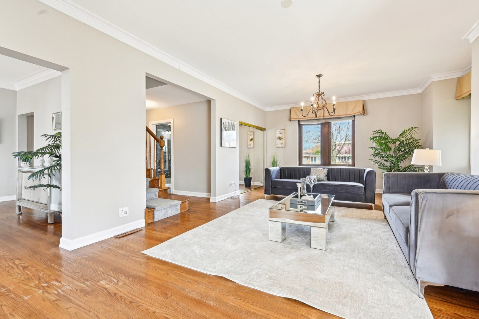 1420 Oakton Street Park Ridge, IL 60068 - Photo 8 of 62 a living room with furniture and a chandelier