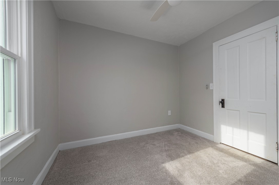 218 Roxboro Road Vermilion, OH 44089 - Photo 23 of 50 Unfurnished room featuring light carpet and a ceiling fan