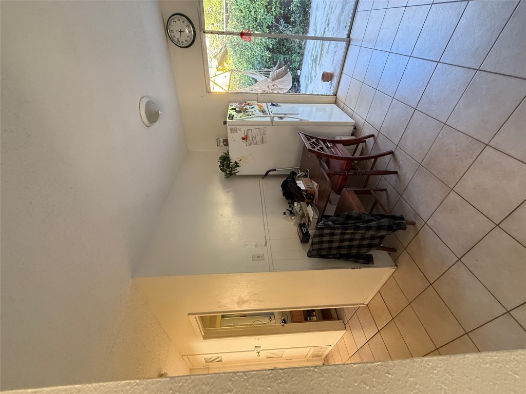 8311 Hathaway Drive, Unit A Austin, TX 78757 - Photo 3 of 6 a view of a workspace with furniture and a window