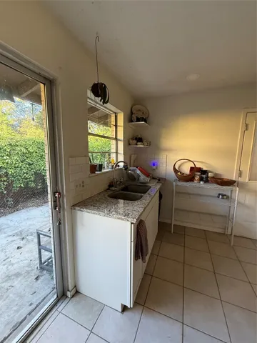a kitchen with a stove and a sink