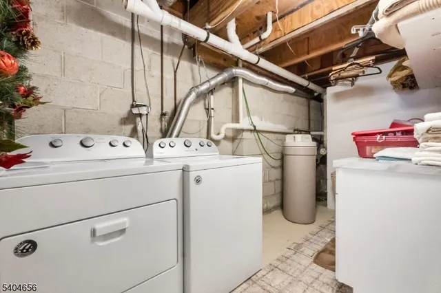 a view of a backyard with chairs and potted plants