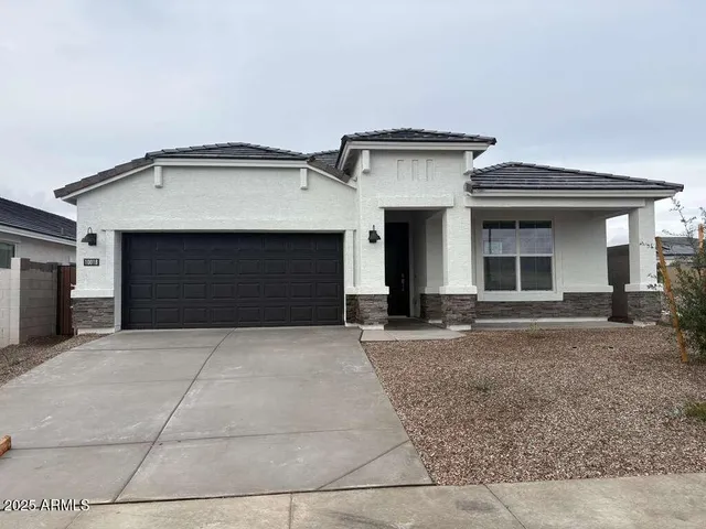 a front view of a house with yard