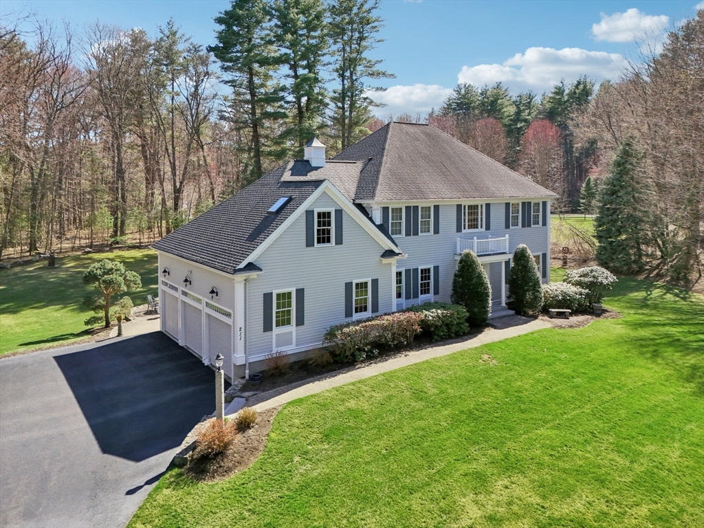 211 Red Acre Road Stow, MA 01775 - Photo 33 of 35 a aerial view of a house next to a yard