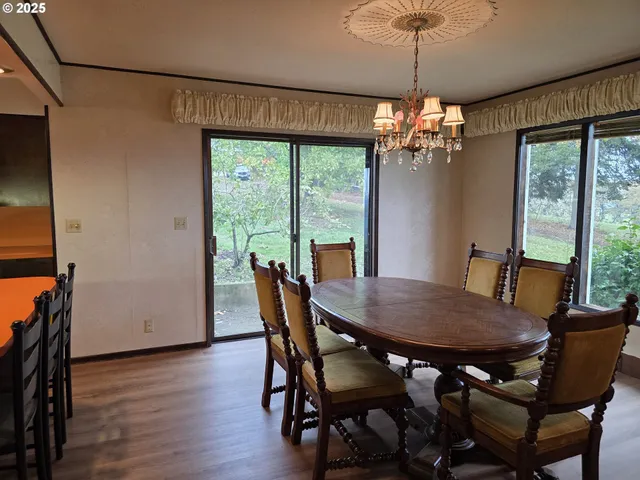 a view of an empty room with a fireplace and a window