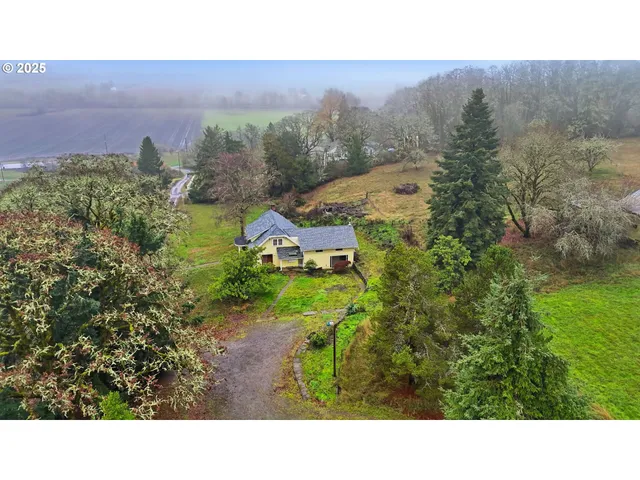 a view of an empty room and a window