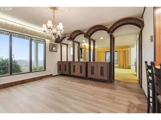 a kitchen with a refrigerator sink and cabinets