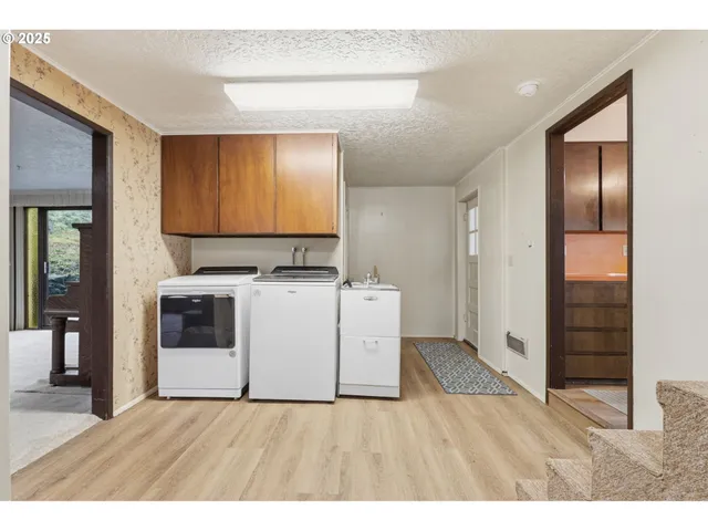 a view of a livingroom with furniture and a fireplace