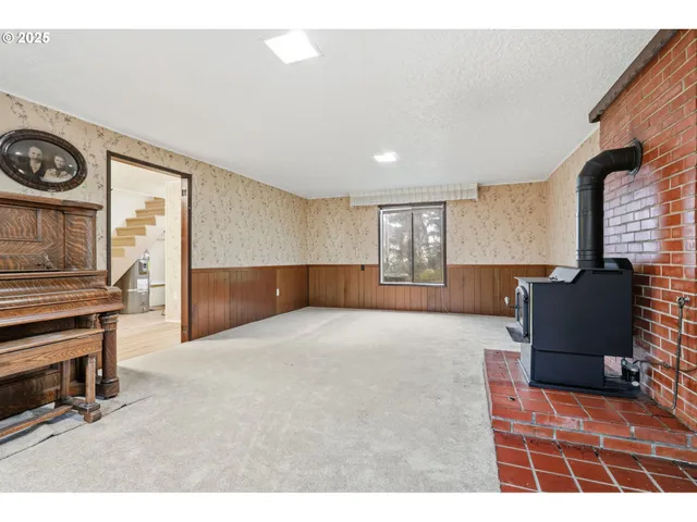 a view of an empty room and a window