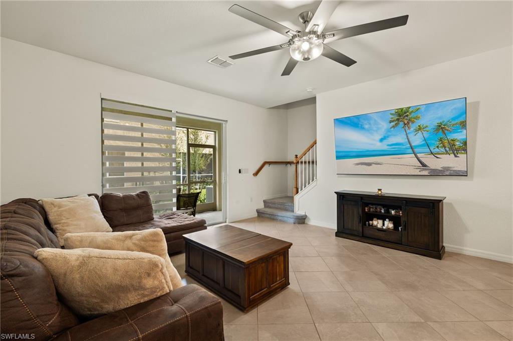 2934 Citrus Street Naples, FL 34120 - Photo 9 of 29 a living room with furniture and a fireplace