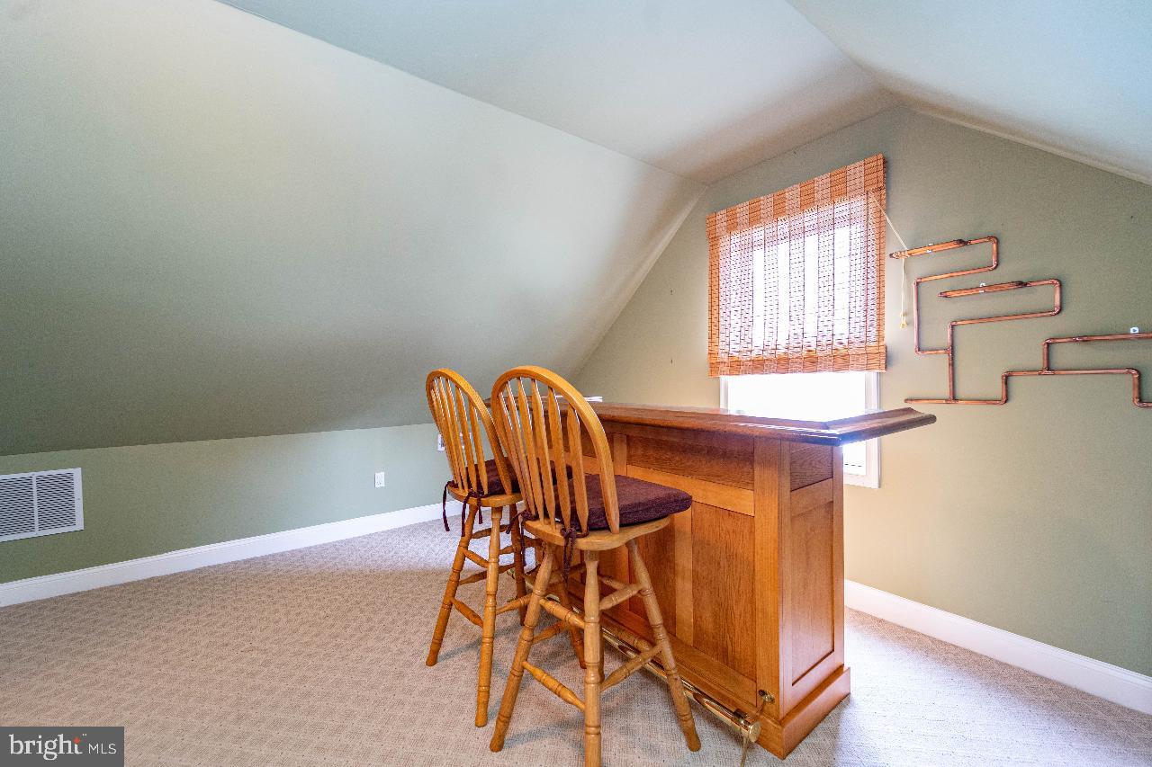4 Helena Avenue Baltimore, MD 21221 - Photo 13 of 25 Cozy loft space with charming bar area.