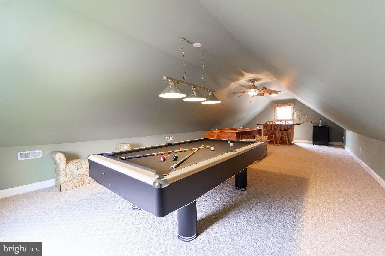 4 Helena Avenue Baltimore, MD 21221 - Photo 15 of 25 Spacious attic game room with cozy charm.