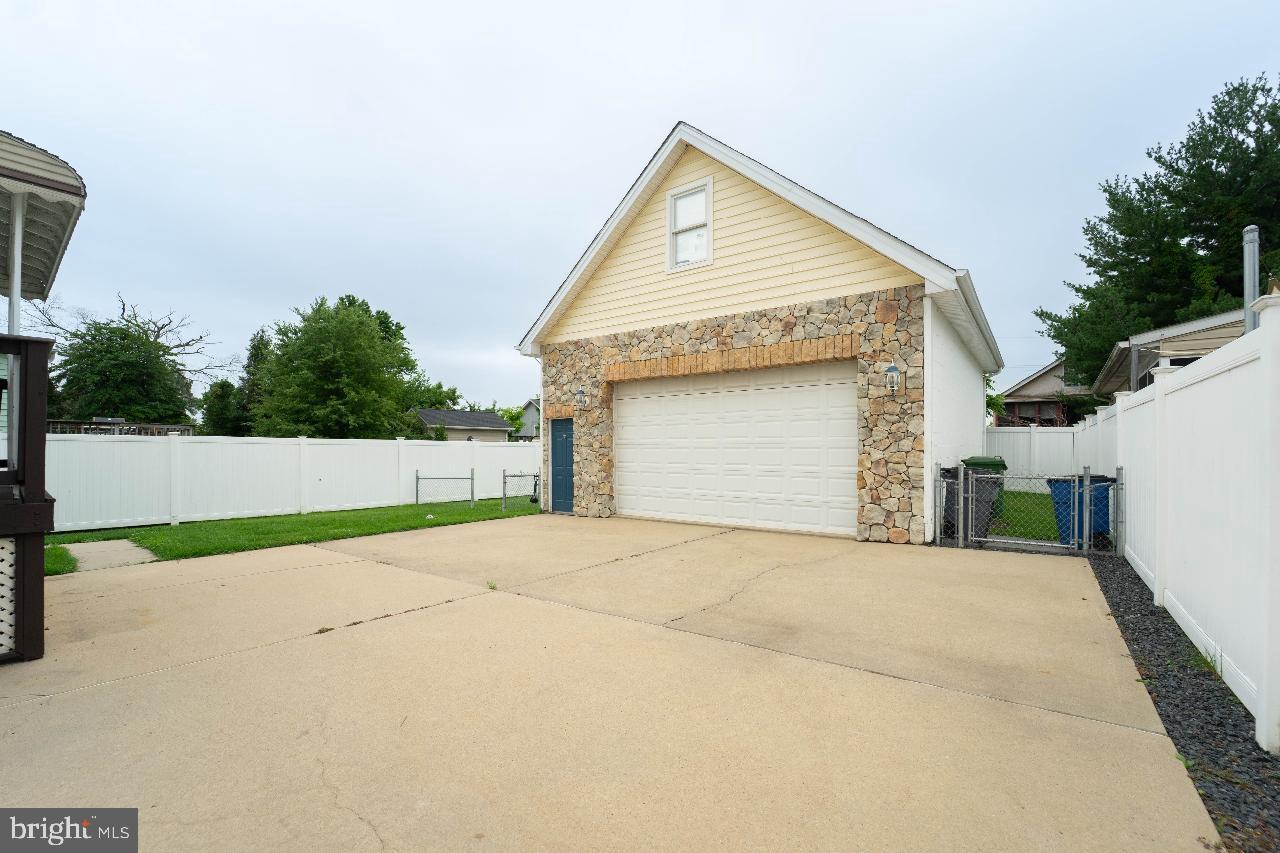 4 Helena Avenue Baltimore, MD 21221 - Photo 24 of 25 Spacious garage with a serene backyard view.