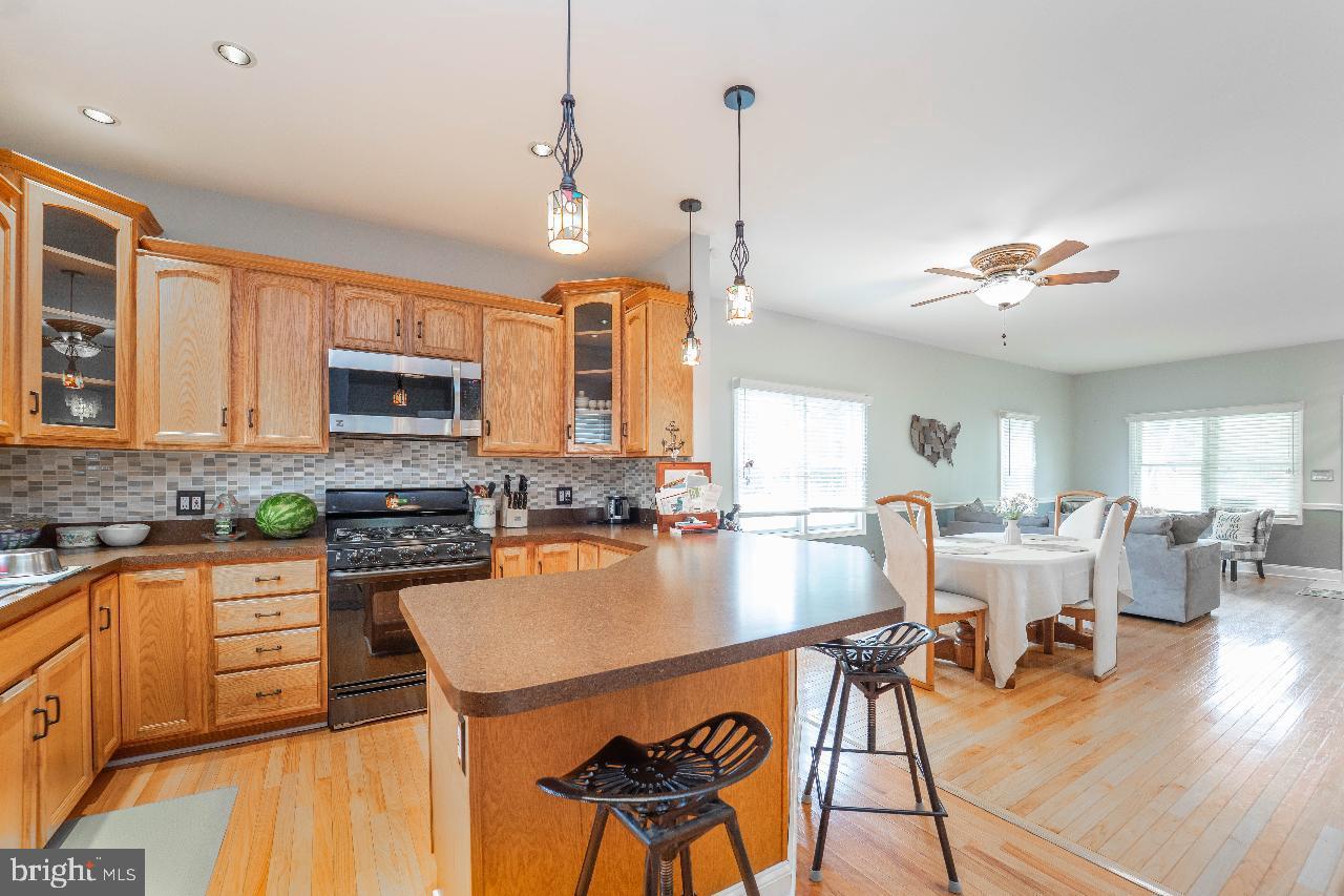 4 Helena Avenue Baltimore, MD 21221 - Photo 6 of 25 Inviting kitchen with warm wooden accents.
