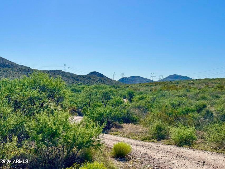 0 Rancho Kulvato Road Vail, AZ 85641 - Photo 2 of 32 a view of a lush green field with mountains in the background