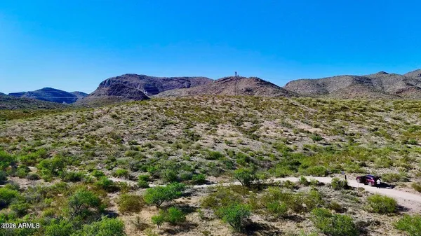 a view of an outdoor space and a mountain
